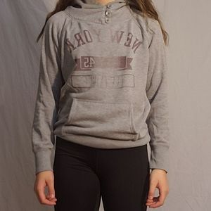 A pink and grey sweatshirt